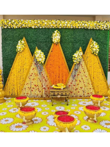 A beautiful haldi ceremoney stage decorated marigold and Rajnigandha flowers.